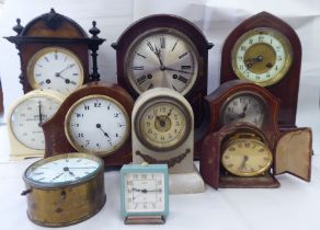 Ten dissimilar early/mid 20thC clocks: to include an Edwardian string inlaid mahogany cased