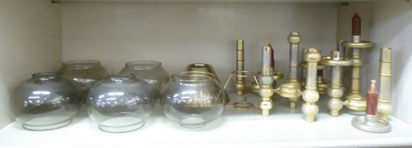 Modular components of brass candelabra with glass shades, possibly Scandinavian