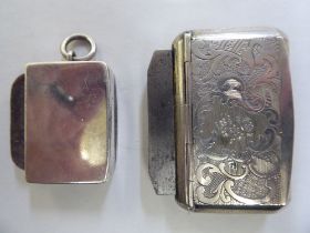 A late 19thC white metal vesta case of box design with engraved decoration, hinged lid and steel