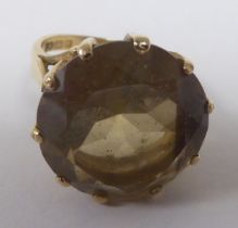 A 9ct gold cocktail ring, set with a round cut smokey quartz