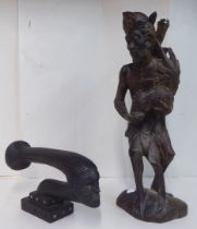 Two tribal hardwood carvings, viz. a male figure holding a cockerel  16"h; and an elongated bust