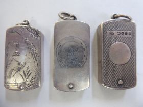 Three similar late Victorian silver vesta cases, incorporating strike plates and rotating access,