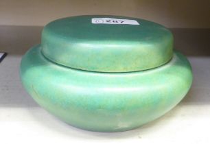 A Royal Lancastrian pottery pot and cover, decorated in pastel colours  5"dia