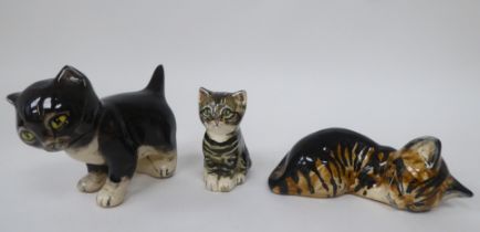Three 1970s Fulham Studio pottery model cats, in various poses by A Short, designed by Seiveshall