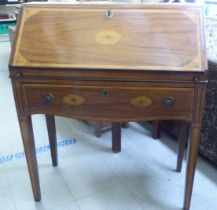 A lady's Sheraton inspired rosewood and satinwood bureau with fan marquetry ornament, the fall front