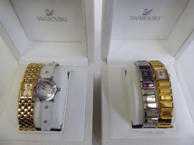 Three ladies Swarovski  wristwatches; another by Saint Honore; and two Swarovski cases  two with