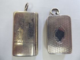 A mid Victorian engine turned and engraved miniature silver vesta case with a hinged lid, strike