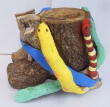 'Squeeze' a snake themed overpainted tree stump  bears an indistinct signature  10"h