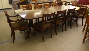 A modern Regency style mahogany twin pedestal dining table, the two D-ends with a pair of additional