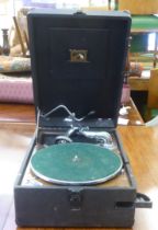 An HMV table-top gramophone, in a hard case