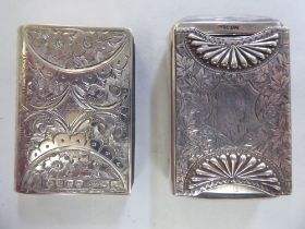 A Victorian silver vesta case, fashioned as a book and incorporating a strike plate with bright