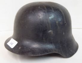 A World War II period German steel helmet  (Please Note: this lot is subject to the statement made