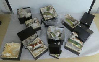 Reproductions of 19thC Staffordshire and Chelsea pottery, mainly cow creamers and ornaments  boxed