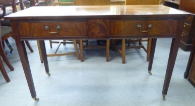 An Arthur Brett & Sons, Norwich, Georgian style mahogany serving table, the two inline drawers