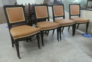 A set of four early 20thC mahogany framed dining chairs, raised on ring turned, tapered forelegs and
