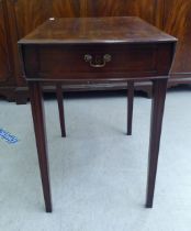 A 19thC style mahogany Pembroke table, the oval top over an end drawer and facsimile on the reverse,
