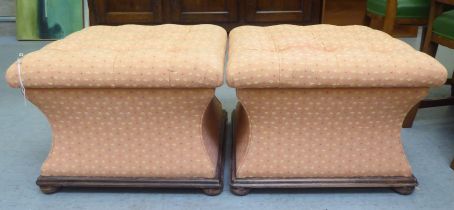 A pair of Regency inspired, waisted square box ottomans, part button upholstered with patterned