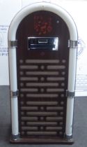 A modern CD player, fashioned as a vintage freestanding jukebox  32"h  16"w