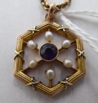 A yellow metal pendant, set with a central amethyst, surrounded by pearls  stamped 9ct, on a