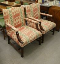 A pair of modern Georgian inspired mahogany framed open armchairs with high backs, upholstered in