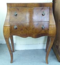 A 19thC style Italianate design fruitwood and marquetry two drawer, bombe front commode, raised on