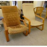 Two similar mid 20thC beech framed chairs with open arms, on cantilevered underframes