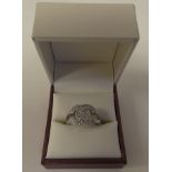 A silver coloured metal cubic zirconia set dress ring