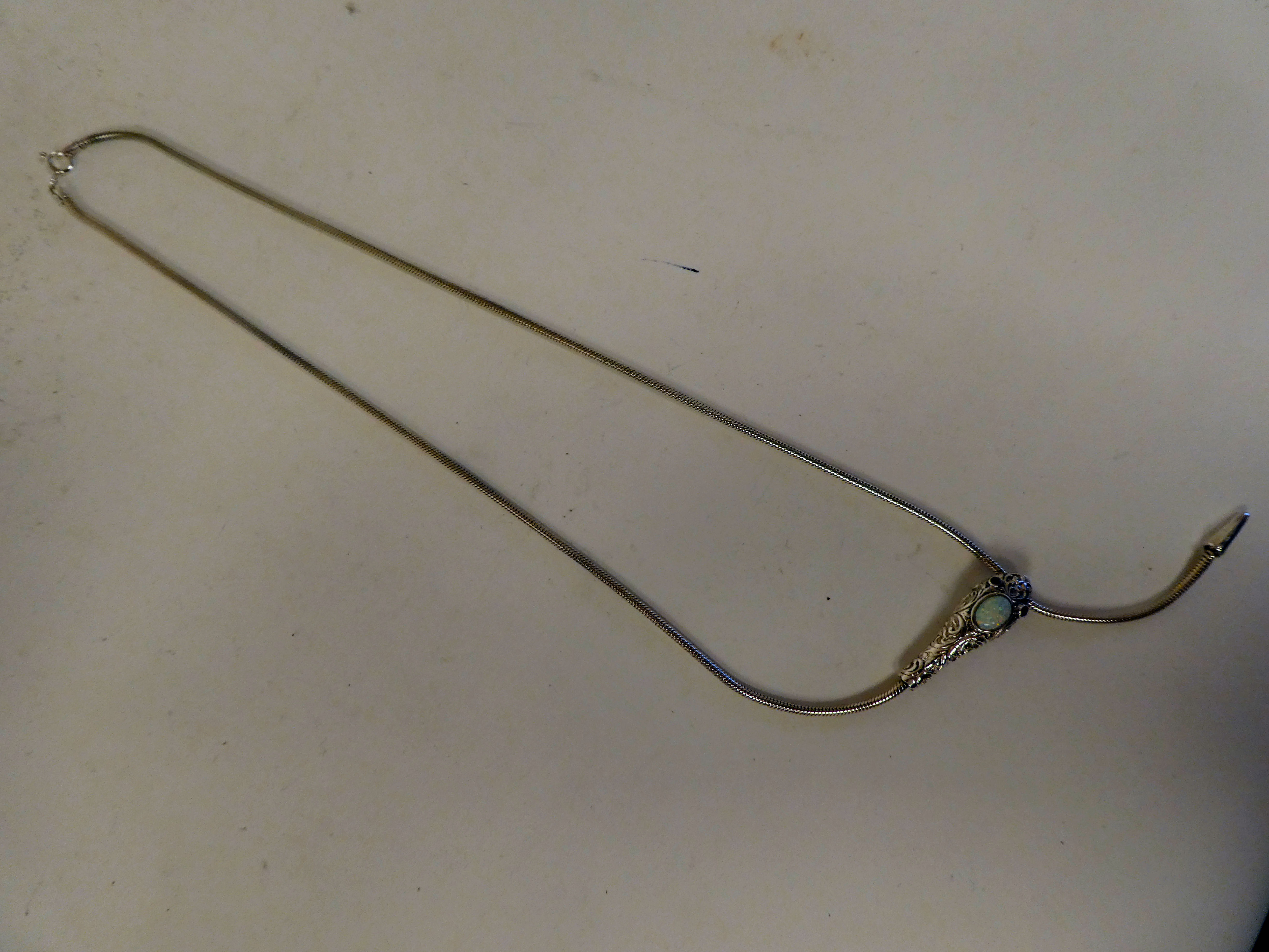 A silver coloured metal, opal set snake necklace with ruby set eyes - Image 3 of 3