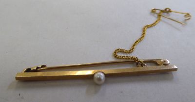 A 9ct gold bar brooch, set with a single pearl  boxed