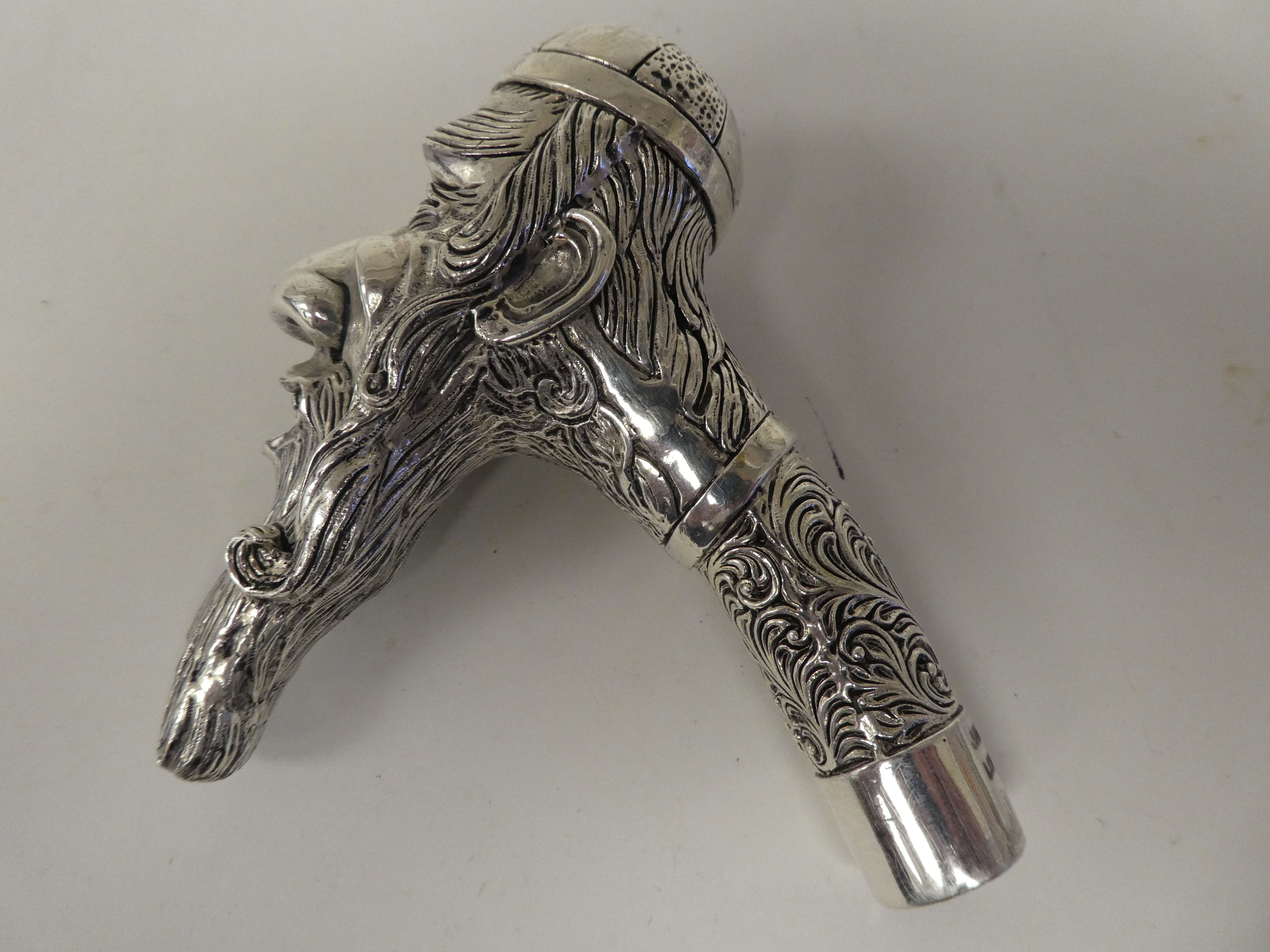 A silver plated walking stick terminal, fashioned as a rabbi's head