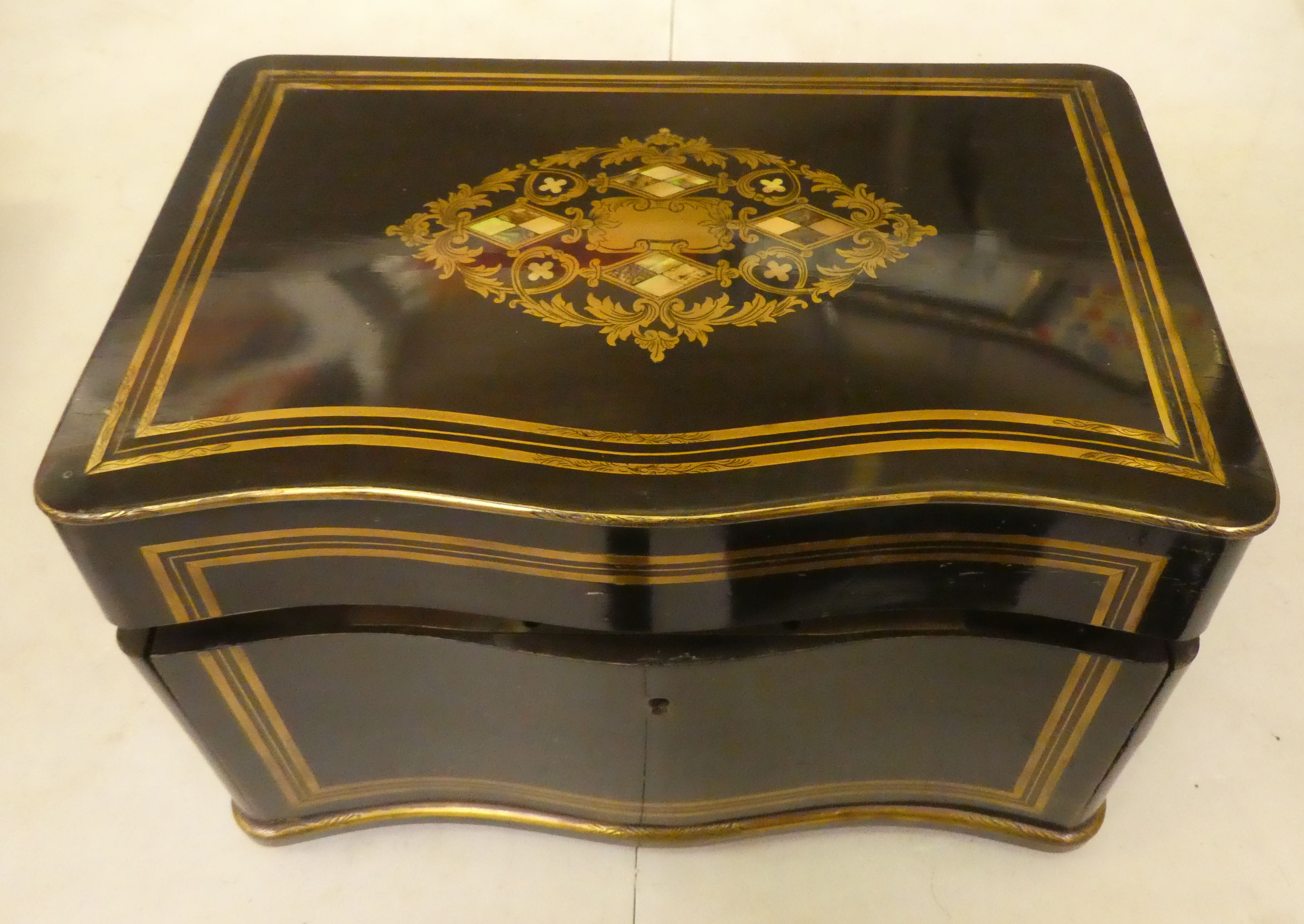 A 19thC black lacquered and gilded metal, serpentine front desktop humidor, finely decorated with - Image 2 of 7