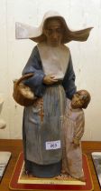 A Lladro porcelain group, a nun and child  16"h