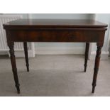 A mid Victorian mahogany tea table, the foldover top with round corners, raised on ring turned,
