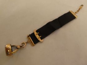 A late Victorian 9ct gold and black fabric seal fob and strap