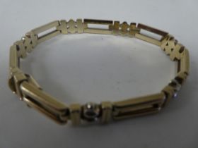 A 9ct bi-coloured gold rod link bracelet, on a bayonet clasp