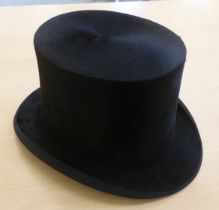 An early 20thC Dunn & Co black silk top hat  21cm front to back  16cm side to side