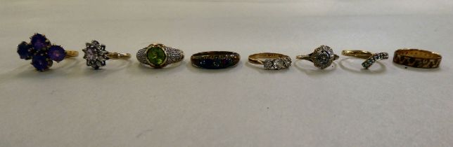 Eight various gold coloured metal and other, variously set dress rings