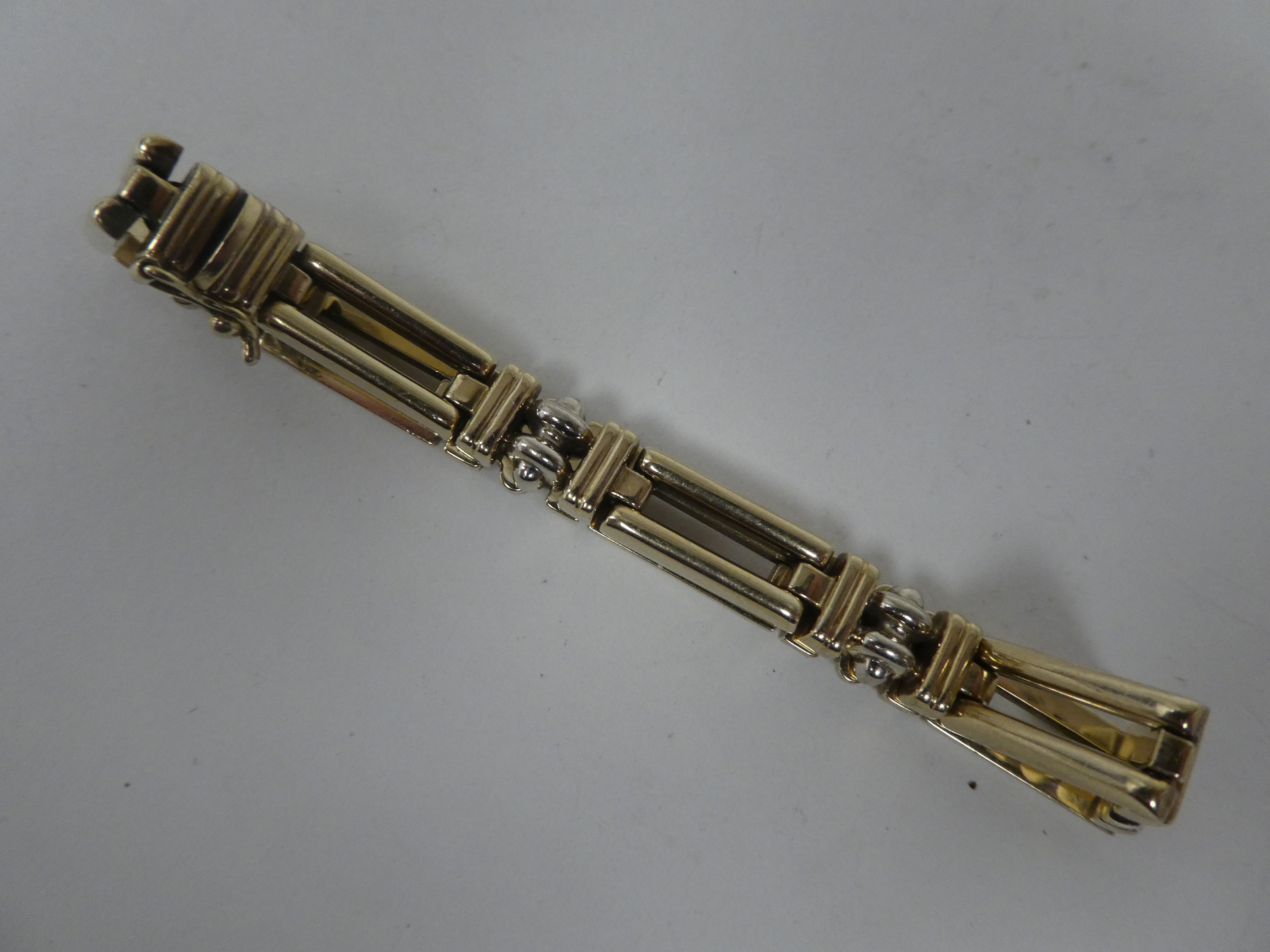 A 9ct bi-coloured gold rod link bracelet, on a bayonet clasp - Image 2 of 3