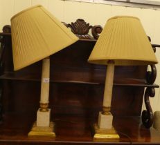 A pair of gilt metal and onyx table lamps with Corinthian columns, on a plinth  18"h