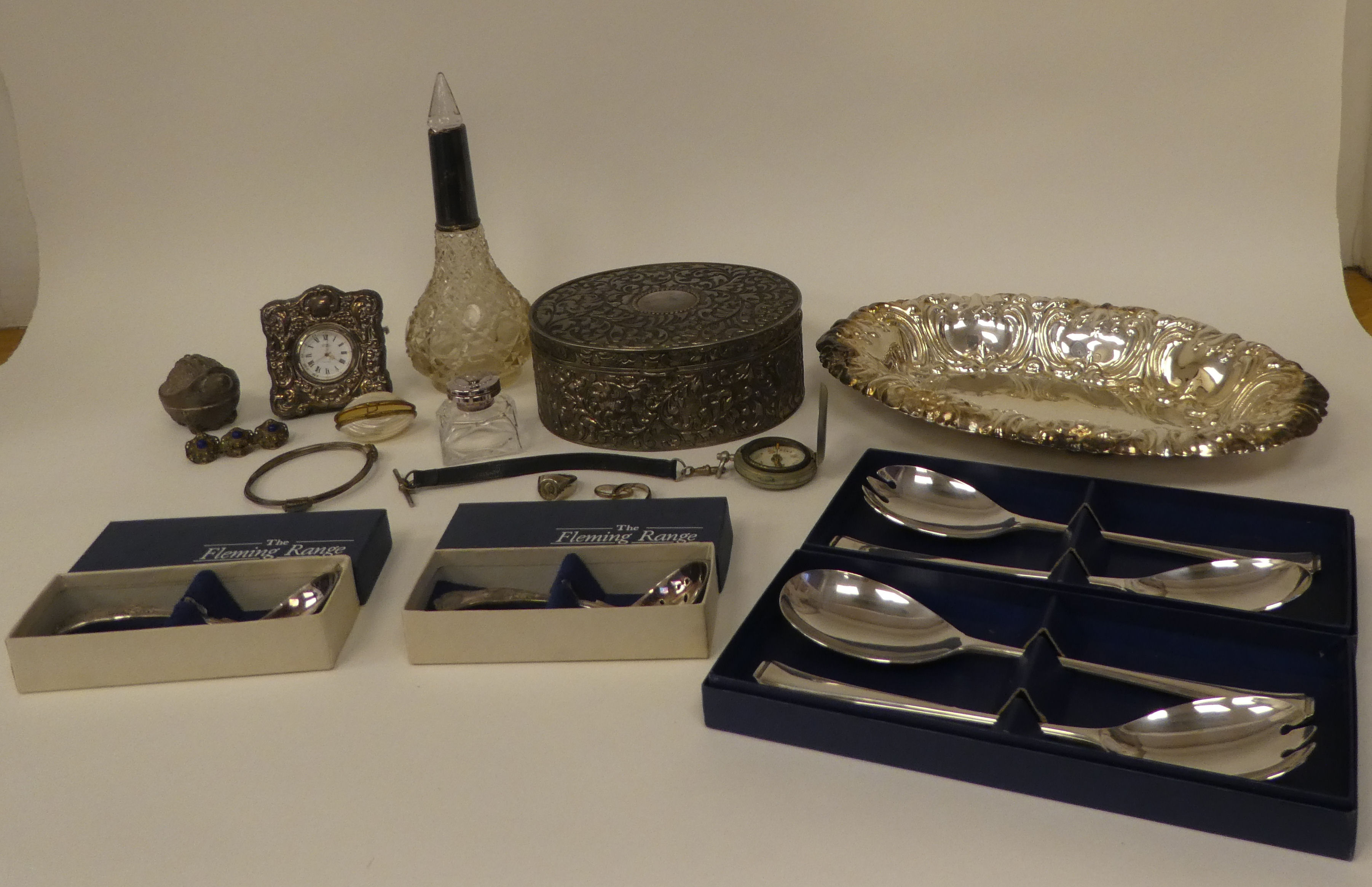 A mixed lot: to include a modern glass inkwell with a silver collar and hinged cap; and an oval base