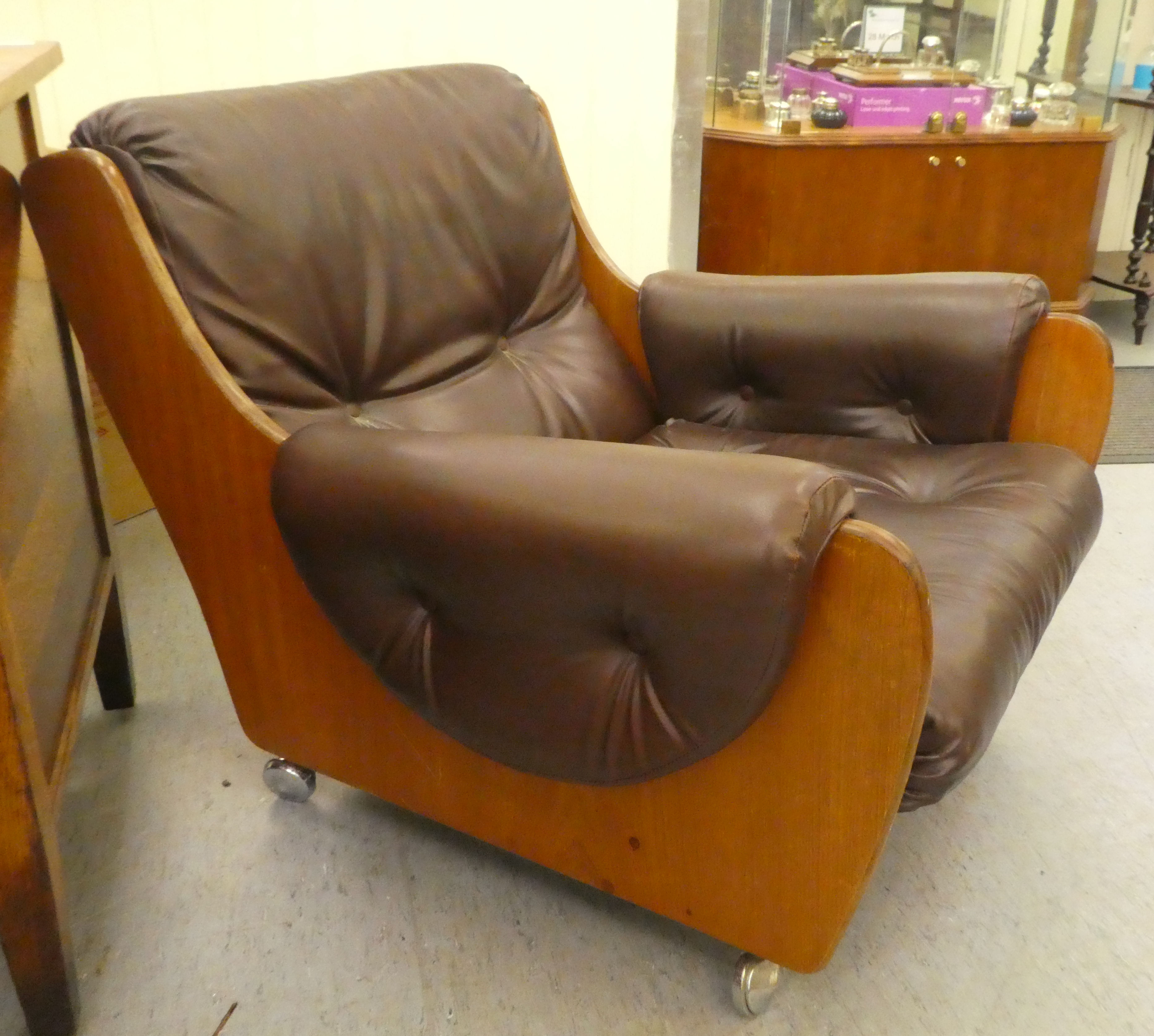 A 1960/70s G-Plan teak framed easy chair with a faux brown hide upholstered back and seat - Image 4 of 4