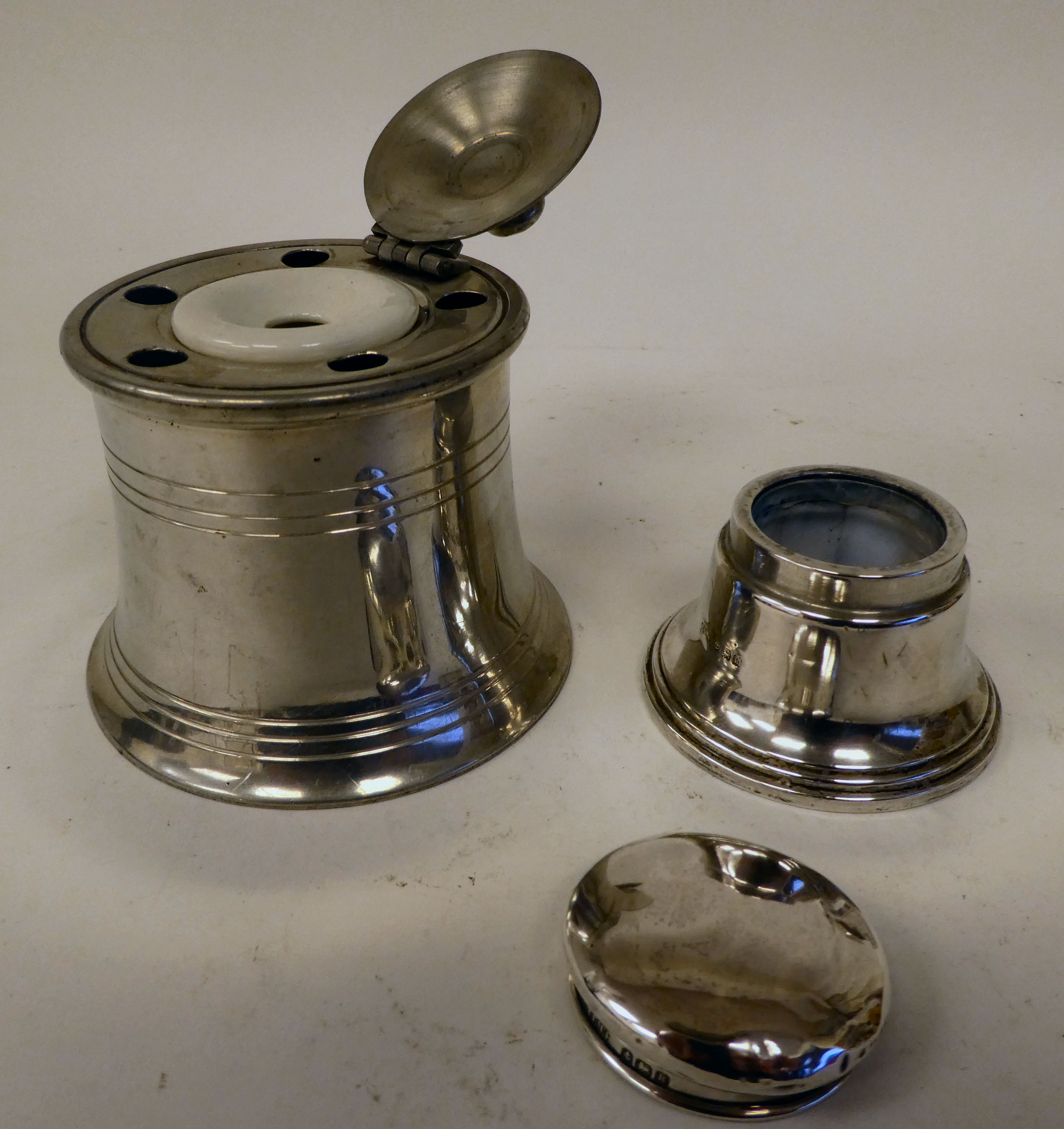 A miscellany of early 20thC and later inkwells: to include an example in silver, of capstan - Image 7 of 10