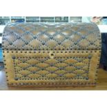 A modern brown faux hide stud upholstered dome top trunk with a hinged lid  15"h  20"w  12"deep