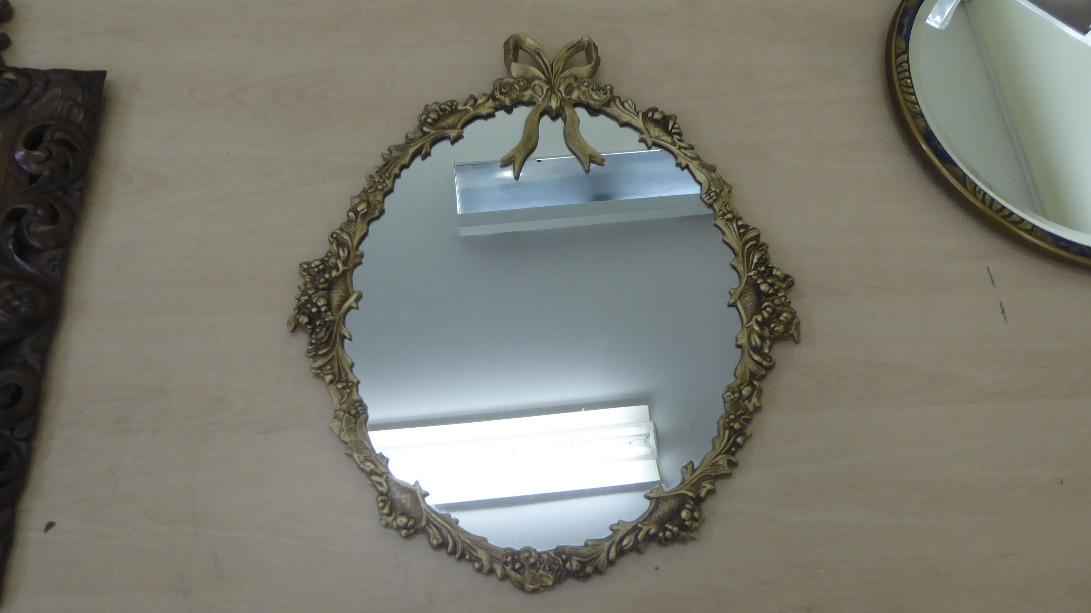 Four dissimilar mirrors: to include one with a bevelled edge, set in a carved and stained hardwood - Image 3 of 4