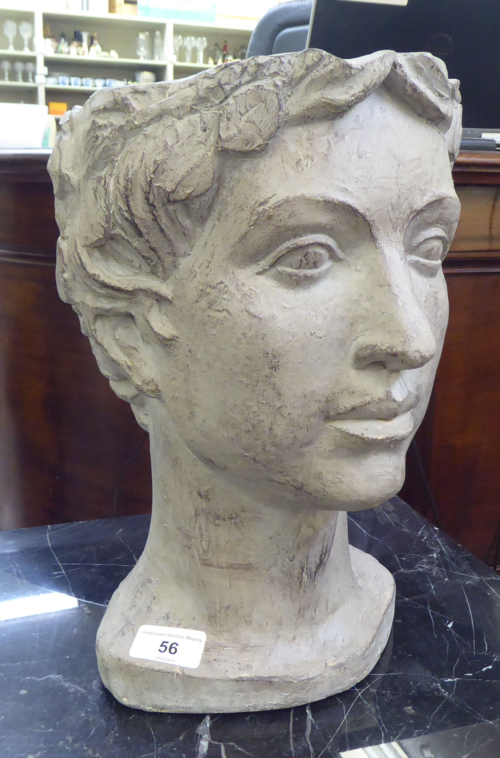 A painted plaster planter, fashioned as a young woman's head  13"h