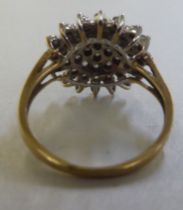 A gold coloured metal diamond set star design cluster ring