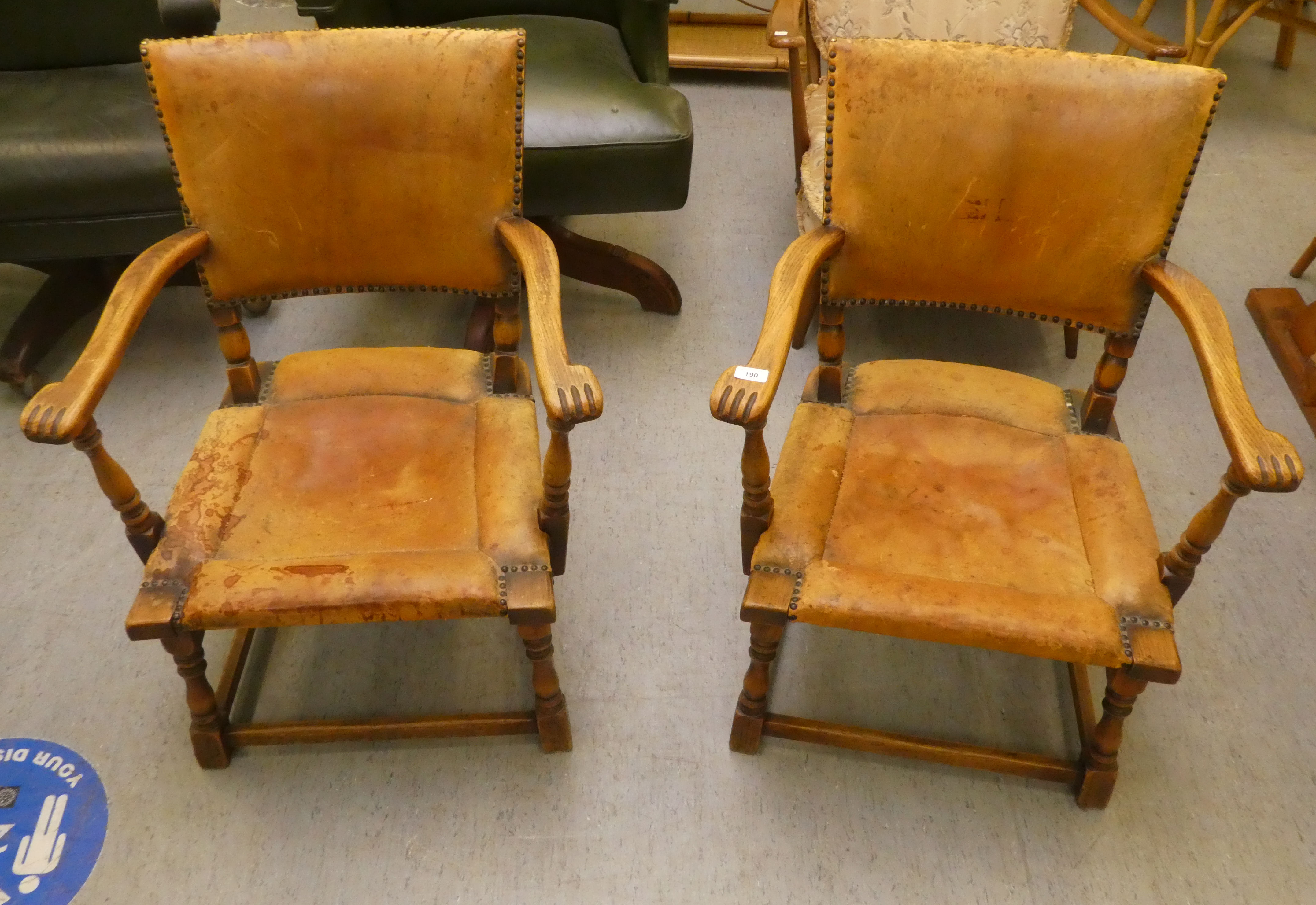 A pair of 1930w oak framed chairs with brown hide upholstered backs and seats, raised on block legs - Image 2 of 5