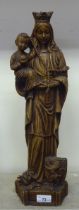 A Continental faux carved wooden moulded, pottery figure 'Madonna and the Christ Child'  19"h