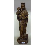 A Continental faux carved wooden moulded, pottery figure 'Madonna and the Christ Child'  19"h