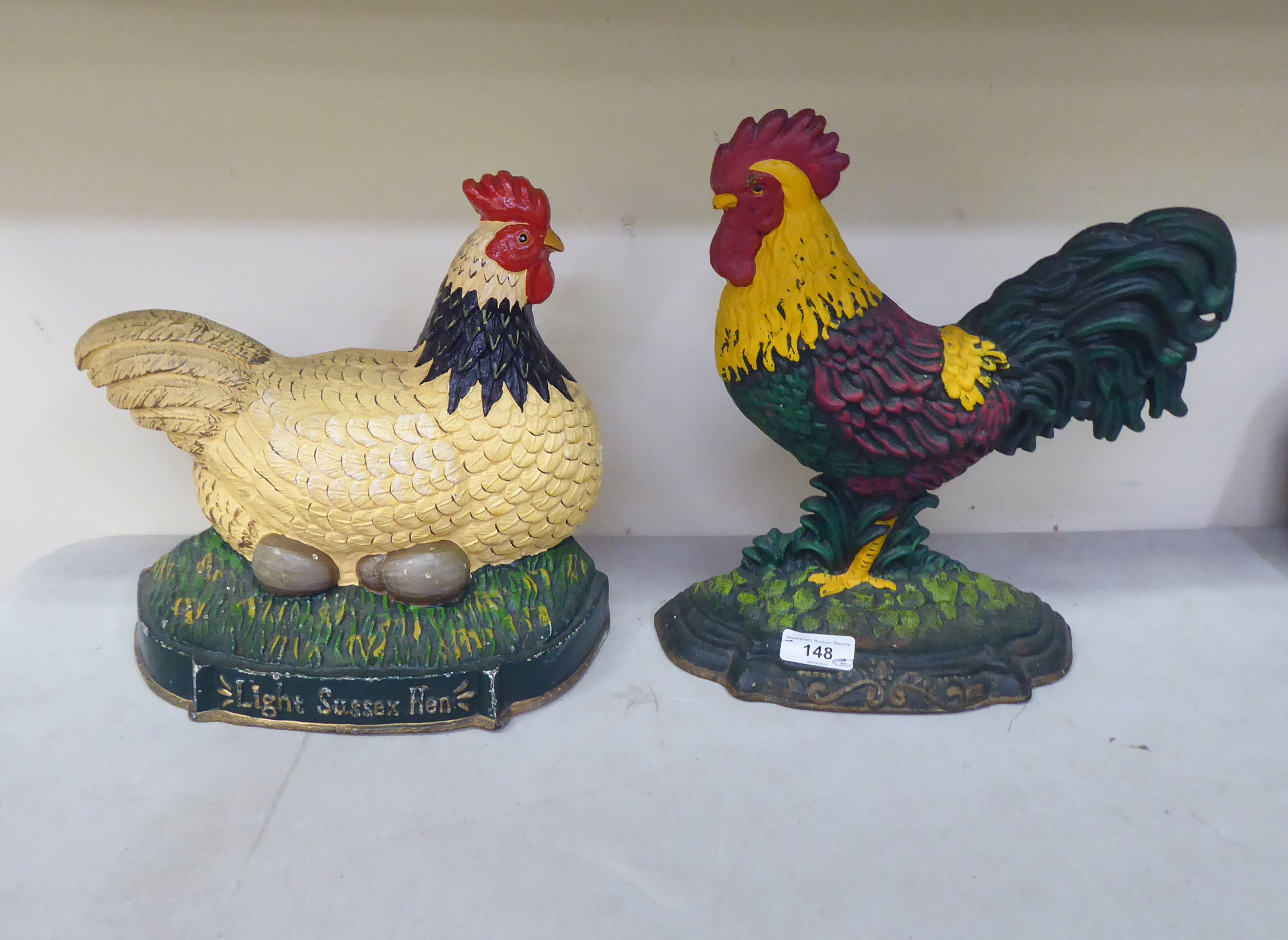 Two cast iron door porters, a chicken  11"h; and a cockerel  12"h